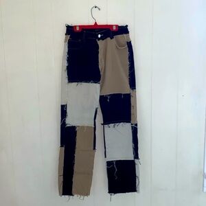 Tri-colored, stretchy, and wide leg jeans.